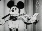 Still from 'Just Mickey' featuring Mickey playing the violin