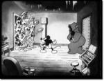 Still from 'The Haunted House' featuring Mickey startled by skeletons