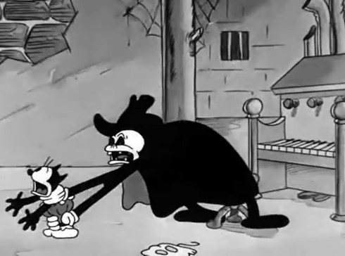 Still from 'Spooks' featuring the phantom grabbing Kitty